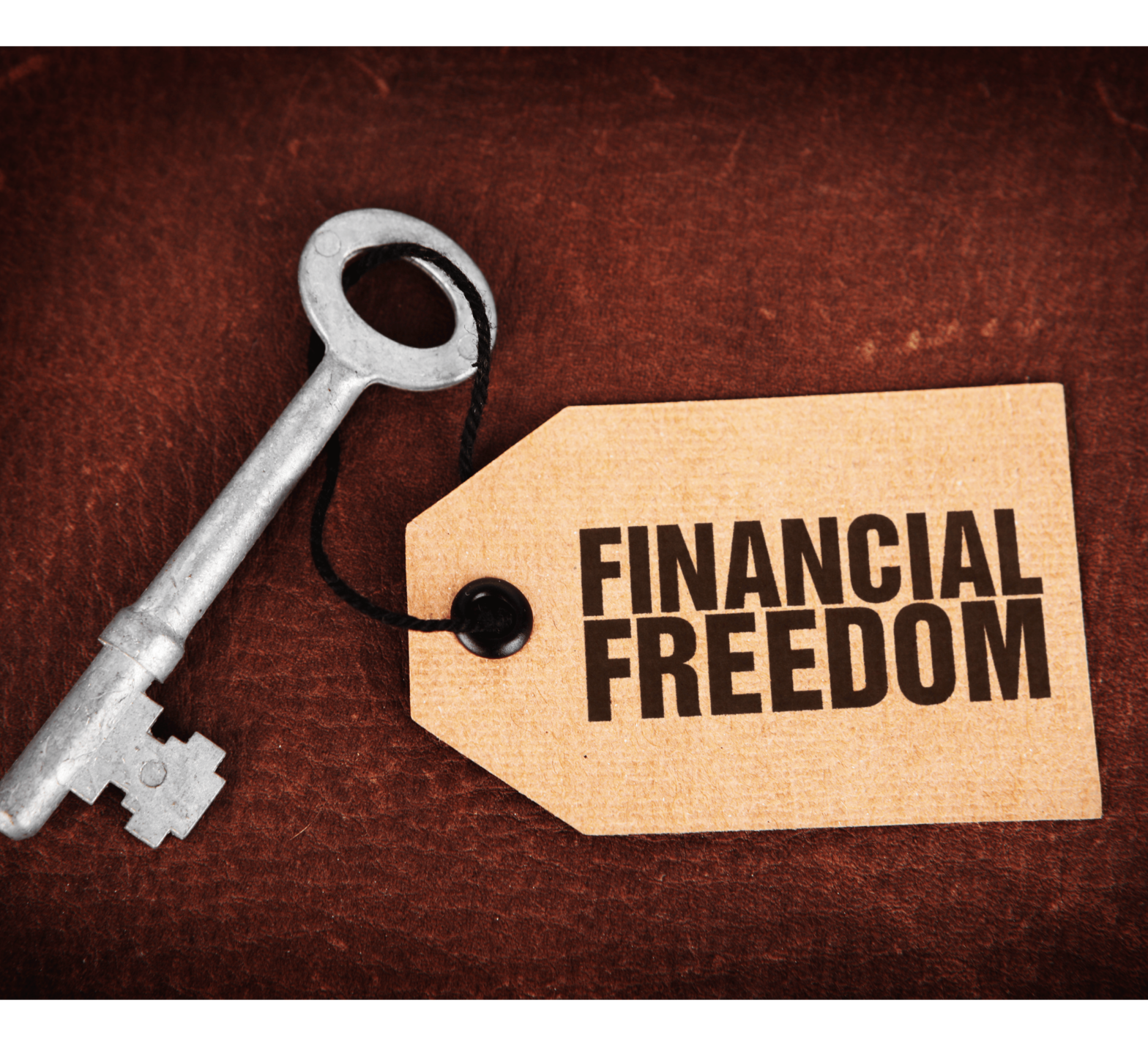 Vintage key with a tag that reads 'Financial Freedom.' Symbolic image representing the key to achieving financial independence and success.